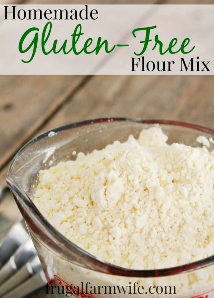 Image shows a glass measuring cup of flour with text that reads "Homemade Gluten-Free Flour Mix Recipe"