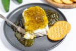 hot pepper jelly on a cheese board